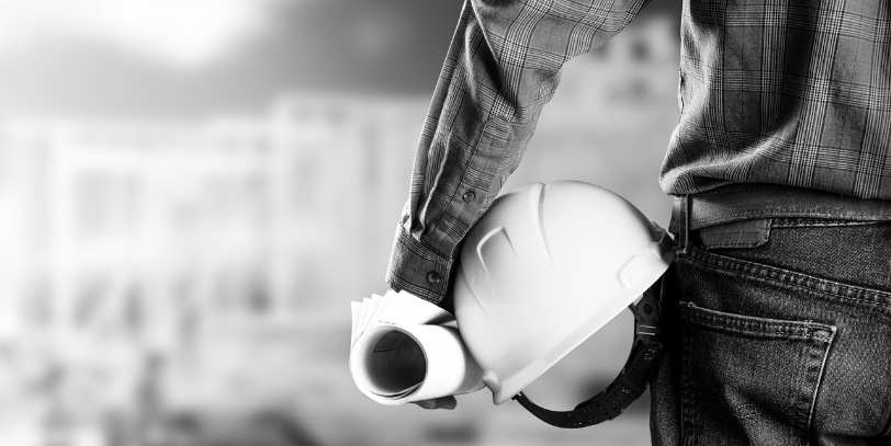 Man holding blueprints